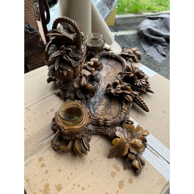 19th c Black Forest carved inkwell. Intricately carved with a bird nesting in a basket that opens to a box, two glass...