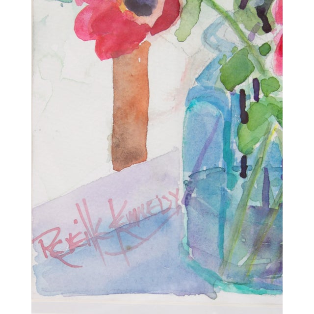 This lovely watercolor uses an impressionist technique to depict a dreamy still life of a blue vase with red poppies and...