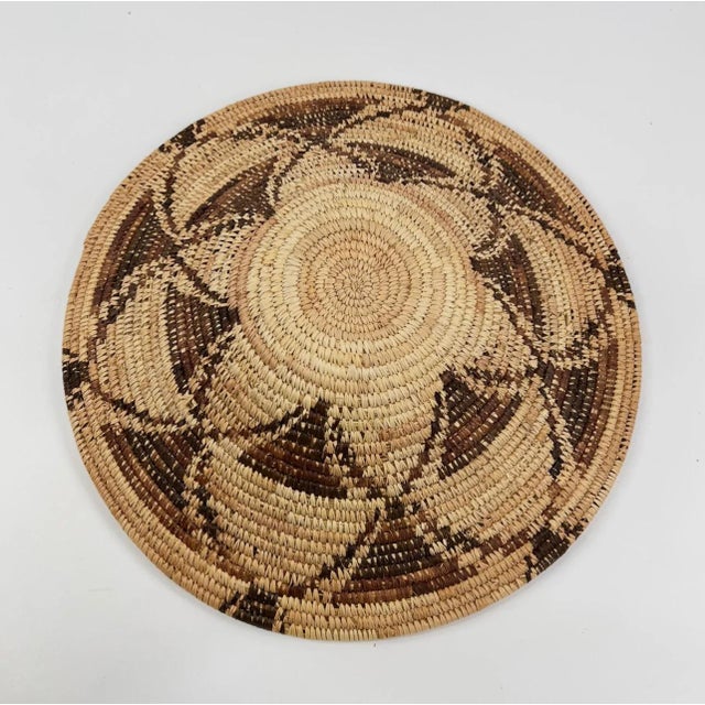 This handwoven basket from Botswana reflects a long-standing tradition of fiber artistry shared across southern Africa,...