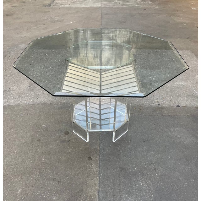 Table produced by Marais International, circa 1980s, octagonal, glass top, acrylic glass base This piece is attributed to...