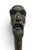 Antique late 19th century to early 20th century walking stick. Wood shaft with sold bronze handle showing a scholarly...