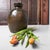 This compact Japanese tsubo (storage jar) has a strong, restrained form: a wide, rounded body with a short neck and a...