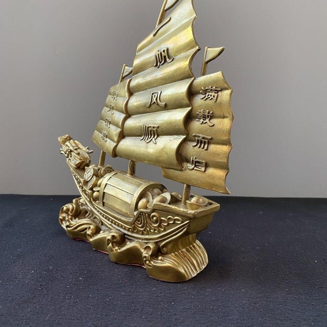 This is a finely cast antique gilt bronze sculpture of a treasure ship, a traditional symbol of prosperity and successful...