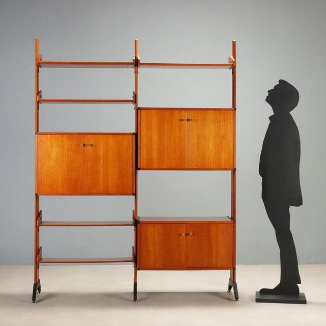 Freestanding bookcase made by AV Arredamenti Contemporanei in the 1960s, in teak veneer. This piece has been carefully...