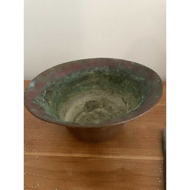 This is a very very old copper pot. In fact, I have not been able to find anything to compare it to the pot is crafted one...