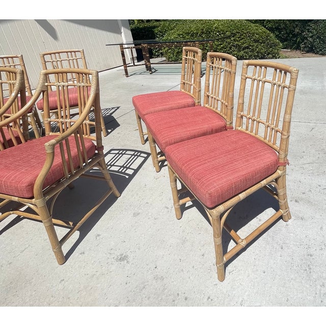 Gorgeous set of 8 dining chairs manufactured by Baker Furniture Co. for the McGuire brand. The set includes 2 armchairs...