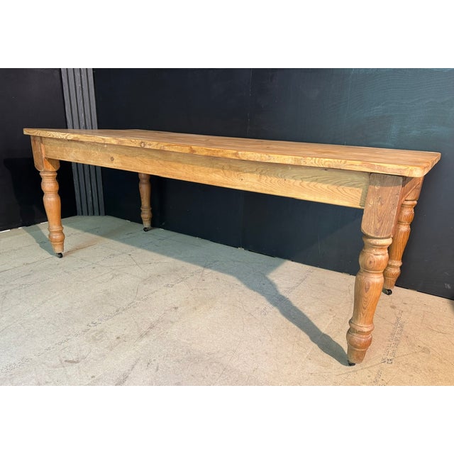 A good antique pine farmhouse dining table. A generous 8 seater, well proportioned with good depth. Sitting on casters and...