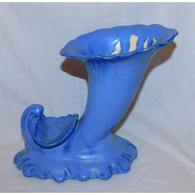 Fulpur Pottery cornucopia-shaped vase in Venetian Blue glaze. Number 4017. Fulper Pottery was incorporated in 1899...