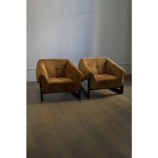 Pair of 1970 Percival Lafer lounge chairs Produced by Lafer S.A. in a beautiful honey suede upholstery with rosewood...