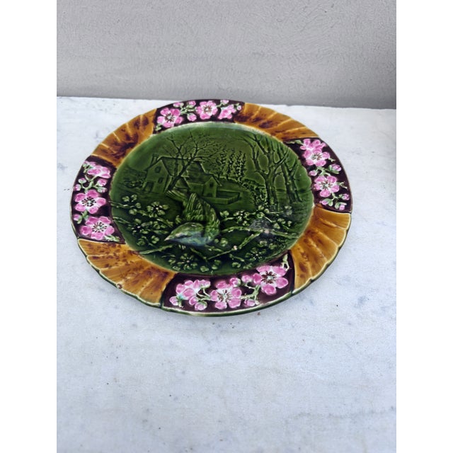 19th Majolica bird plate signed Sarreguemines. This plate represent the Spring with cherries flowers.