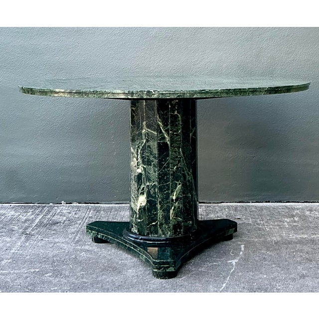 Experience the sculptural grandeur of the postmodern era with this magnificent round dining table, masterfully crafted...