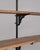 A tall 19th-century French pine display cabinet. The piece features a vertical form with multiple storage areas and a...
