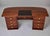 This large French Art Deco executive desk is constructed in mahogany throughout, with a broad top surface featuring...