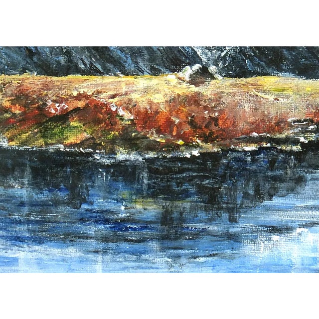 Original oil landscape painting of mountains and lake. Signed lower right. Displayed on a white mat with a gold border and...