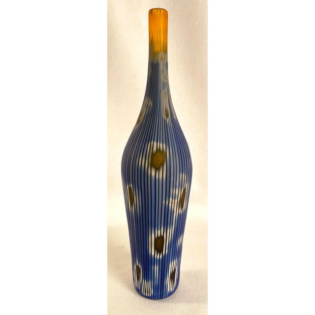 Signed Murano art-glass vase by Vetro Artistico, Murano, featuring a striking palette of rich blues, creamy whites, and...