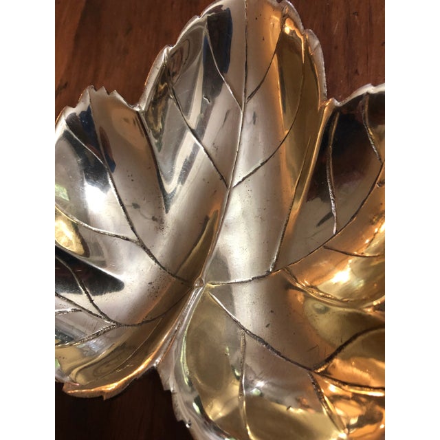 This solid brass trinket dish is the perfect accent for your coffee table or book stack… and it sits on feet! In the shape...