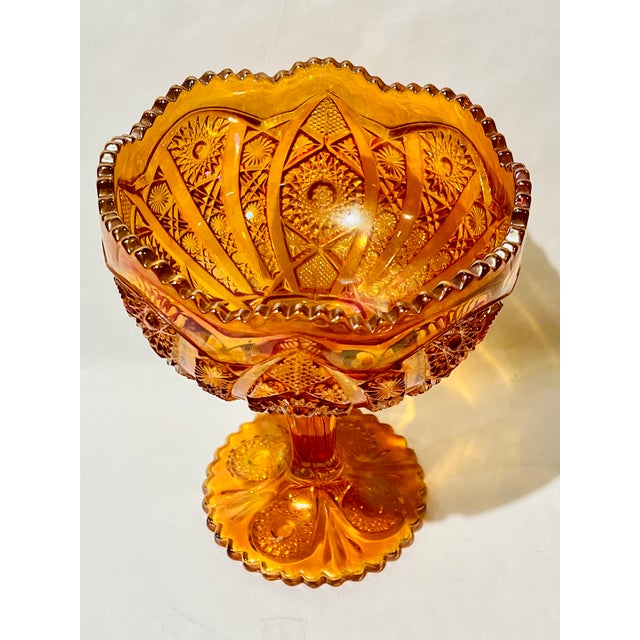 Fabulous, iridescent amber compote footed bowl. Perfect for a sideboard, a centerpiece, or a foyer catchall!