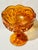 Fabulous, iridescent amber compote footed bowl. Perfect for a sideboard, a centerpiece, or a foyer catchall!