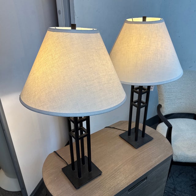 Design Plus Gallery presents a Pair of Modernist Lattice Tower Table Lamps. Each lamp has an open metal tower base with...