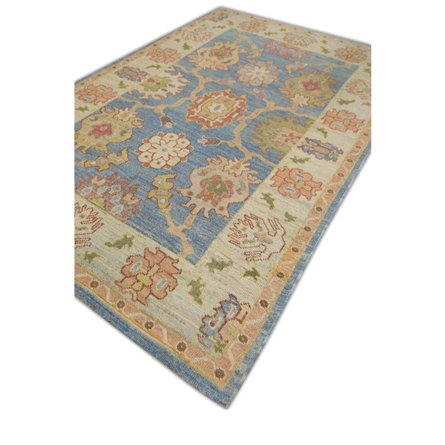 This modern Turkish Oushak rug is a stunning piece of art that has been handwoven using traditional techniques by skilled...