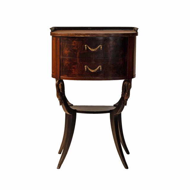 Antique, mahogany veneer side table with two drawers, lower shelf. Carved swans adorn the legs.