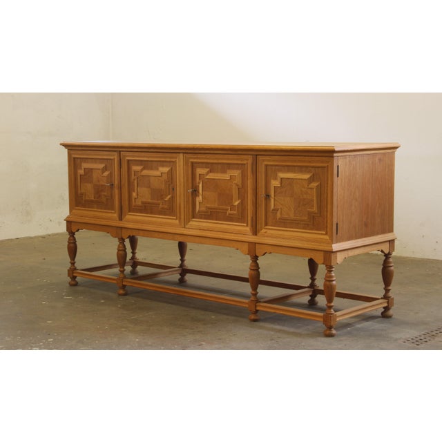 A rare and wellkept furniture in massive oak with a style of danish modern and some design similarities to the Brutalist...