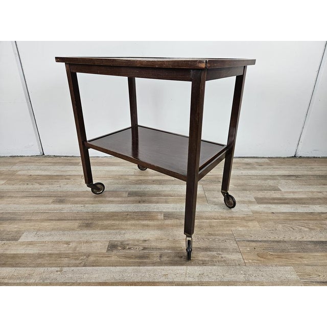 Antique Viennese coffee table by Thonet with double shelf and wheels to be easily moved. It can be used as an entrance...