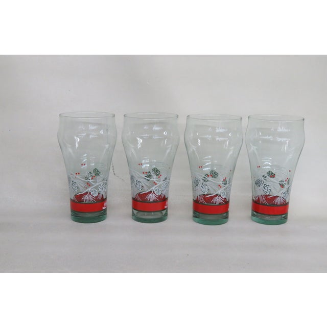 This beautiful Set of 4 Tumbler Cups is made of glass. We believe they were made by Libbey due to their design, however...