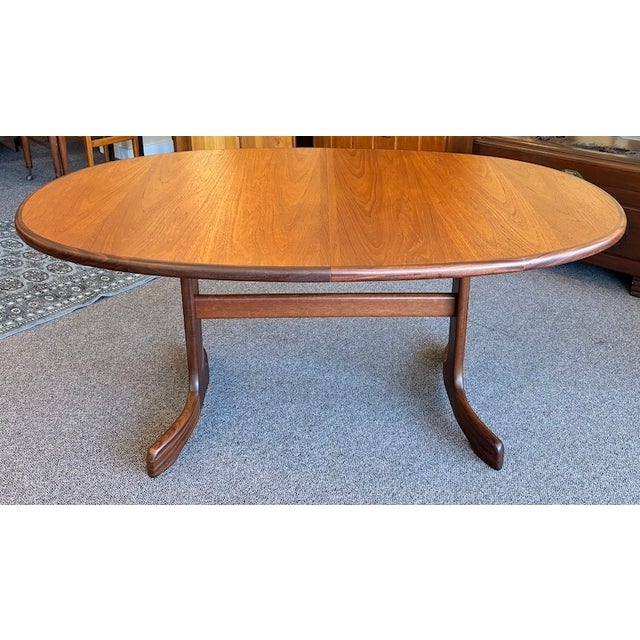 Iconic European Mid Century Modern Extending Oval Teak Dining Table w/ Butterfly Leaf & Whale Fin Pedestal Base by G-Plan...