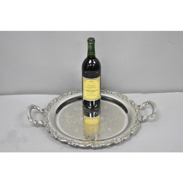 Vintage Oneida Victorian Style Round Silver Plated Serving Platter Tray with Twin Handles. Circa Mid 20th Century....