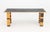 Richard Bloch Dining Table, with inset black linoleum top and striped legs with alternating wood stains. 28.25" H x 73.75"...