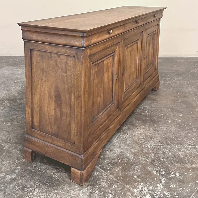 19th Century French Louis Philippe Period Walnut Buffet ~ Enfilade ~ Credenza was lovingly hand-crafted from sumptuous...