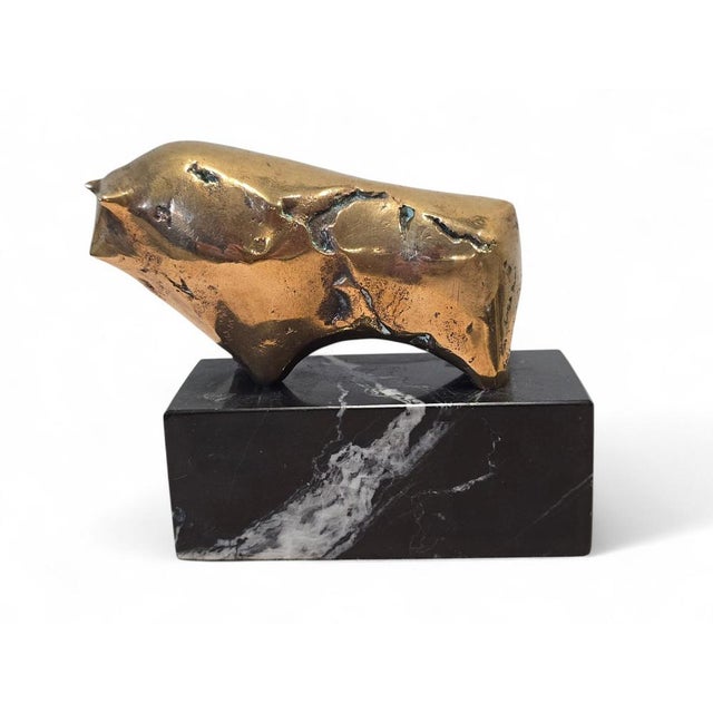 Striking modern bronze sculpture depicting a bull, mounted on an elegant marble base and signed and numbered by the...