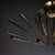 Large-scale Sputnik chandelier in brass featuring twelve angled arms composed of slender rods, radially arranged around a...