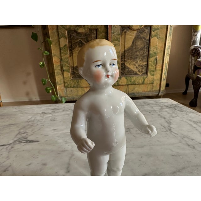 This exquisite Biedermeier porcelain bathing doll, dating back to around 1820, is a fascinating piece of early toy...