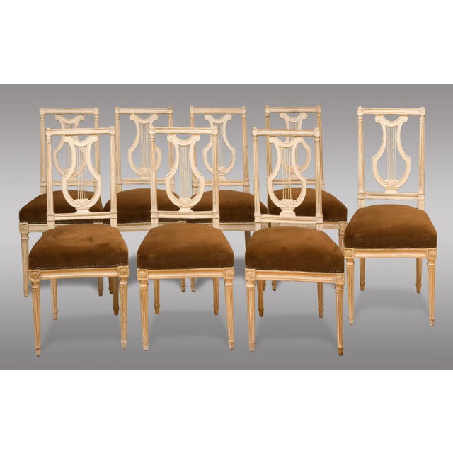 Set of eight Louis XVI period chairs. Five of the chairs are stamped by Gautron. Upholstered in light brown velvet.