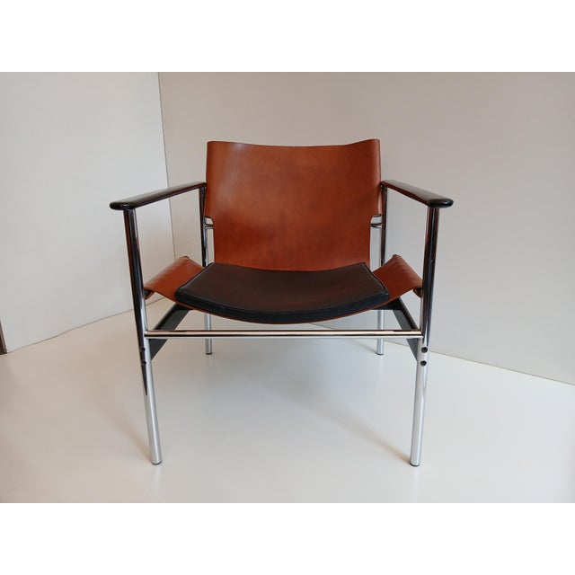 Designed in 1960 and originally produced from 1964 to 1979, the steel and leather "sling chair," or "657" as it is...