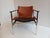 Designed in 1960 and originally produced from 1964 to 1979, the steel and leather "sling chair," or "657" as it is...