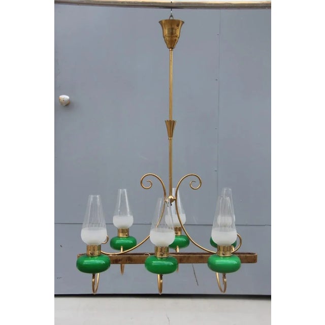 This chandelier takes six-light bulbs with E14 connection, 40W max each. Up to 250V (Europe/UK Standard).The wiring of...