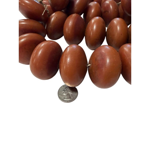 Rare Jumbo Vintage African "Mock Amber" Trade Beads A stunning example of early 20th-century phenolic resin craftsmanship,...