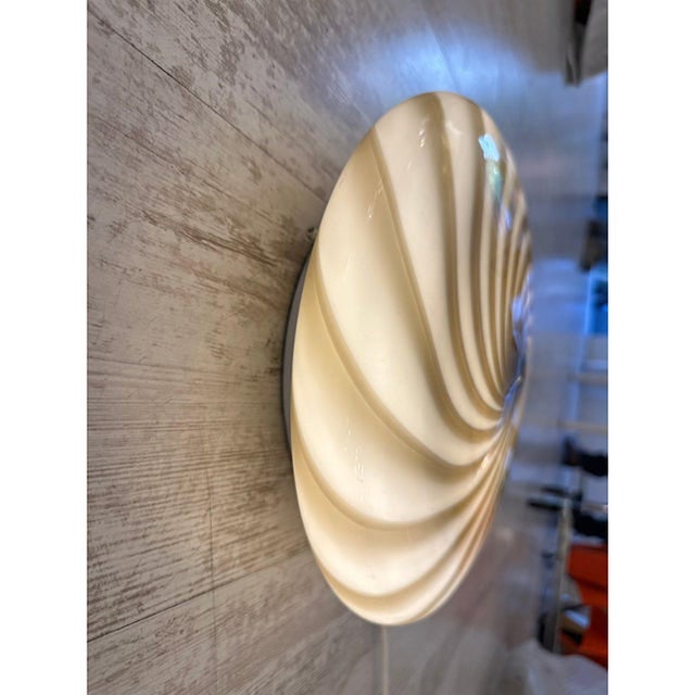 Contemporary milky-white blowing glass with brown "rigadin ritorto" traditional murano working. the base is white so when...