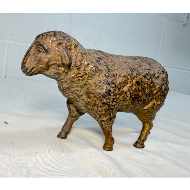 Up for sale is a large antique early 1900's cast iron sheep still bank by Hubley. This collectible bank is unique and...
