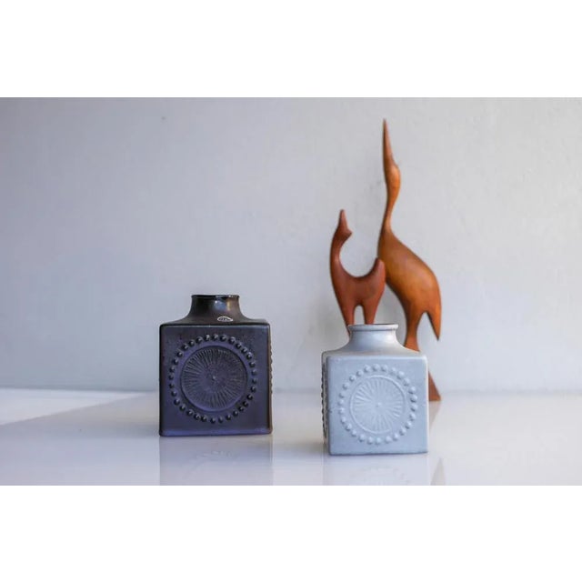 A lovely pair of Mid-century modern vintage vases in a fantastic pale grey and deep indigo blue colors made by the...