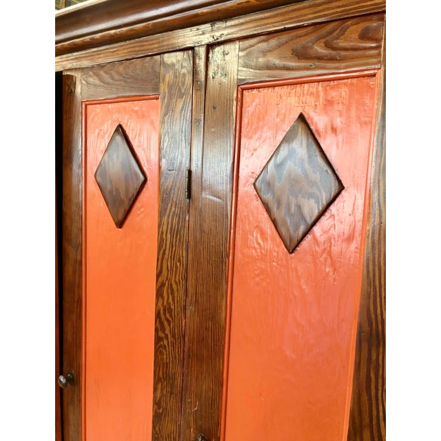 Texas long leaf pine cabinet refinished with (3) doors. Doors are lacquered Orange with diamond designs in natural clear...