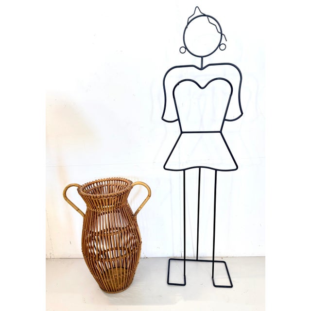 Made in Italy, 1960s- 1970s. This umbrella stand is made in wicker and bamboo. It is a vintage piece, therefore it might...