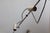A pair of model 1144 wall lamps designed by Tito Agnoli and produced by O-Luce. Their striking design dates back to the...