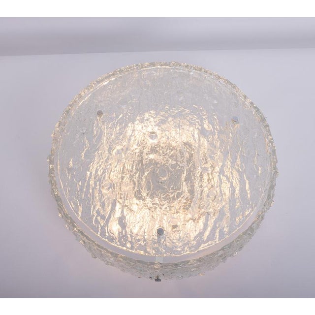 Gorgeous two-part drum-shaped flush mount chandelier with one ring outside and a flat disc made of heavy textured clear...