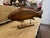 A beautifully crafted carved wooden fish statue mounted on a stand, made circa 2000s in the Coastal / Nautical style. The...