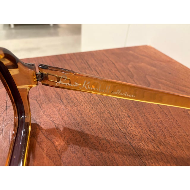 Incredible oversized store display of Laud Kimbell collection Liko eyewear. Amber color hard plastic with gold inset...