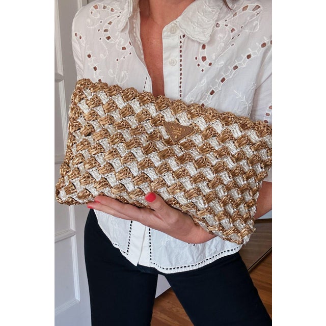 Authentic vintage Prada circa 2012 In mint vintage condition- no imperfections Cream and tan raffia Gold hardware Zipper...
